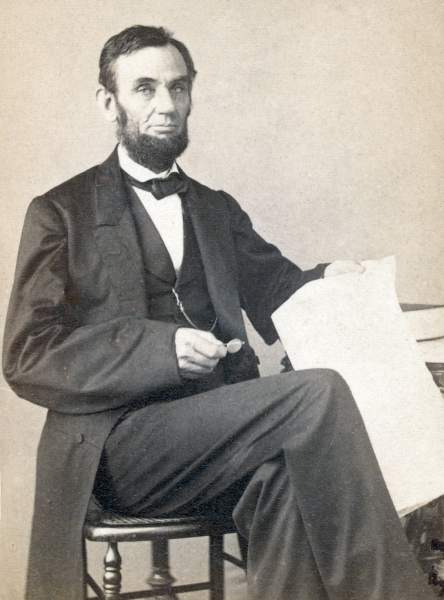 Abraham Lincoln seated with papers, August 9, 1863, Gardner photograph, zoomable image