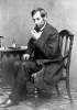 Abraham Lincoln seated at a small table, May 16, 1861, Brady photograph